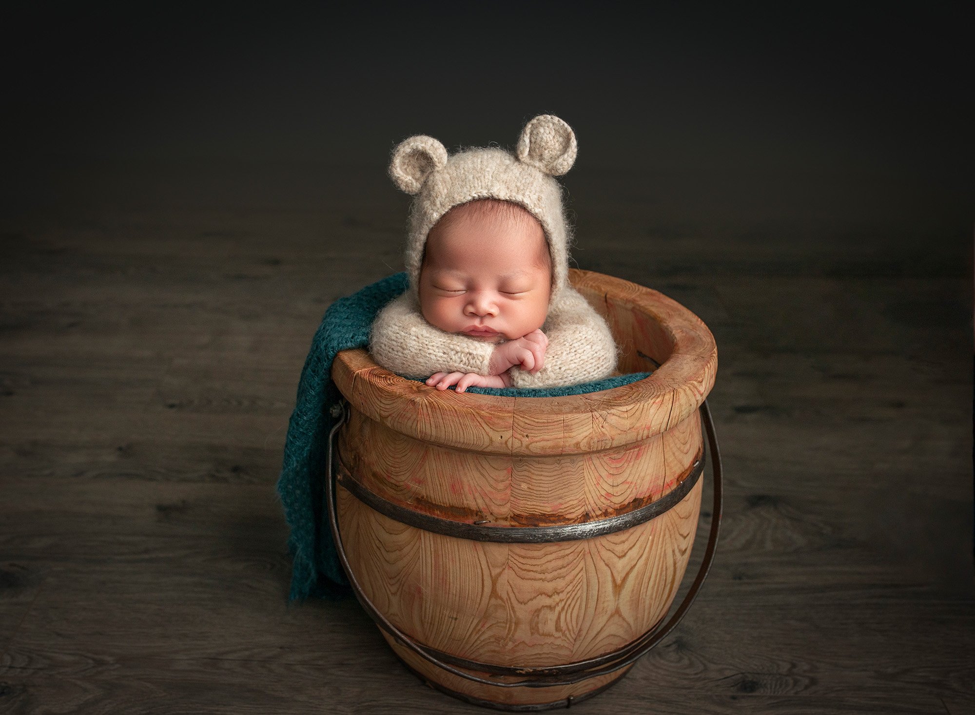 Sleepy Newborn Photos newborn baby boy asleep in bear romper suit inside of a honey pot
