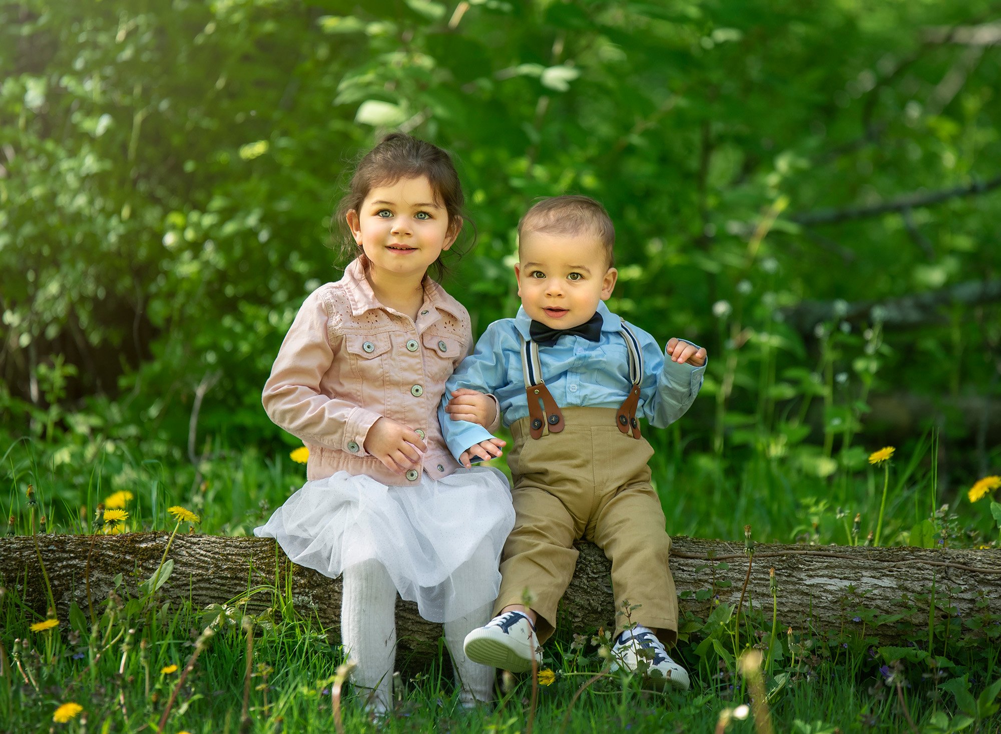 CT Family Photographer infant boy and older sister smiling while sitting on a tree branch