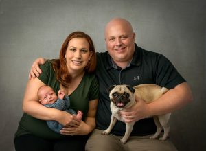 family newborn photoshoot with dog
